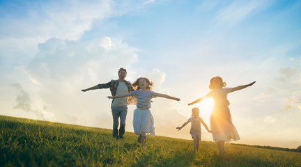 Happy family on summer walk