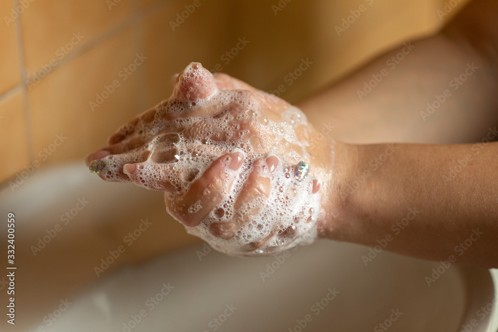 Fototapeta premium Prevention of influenza - Cleaning hands with soap against disease infection versus flu or infulenza,