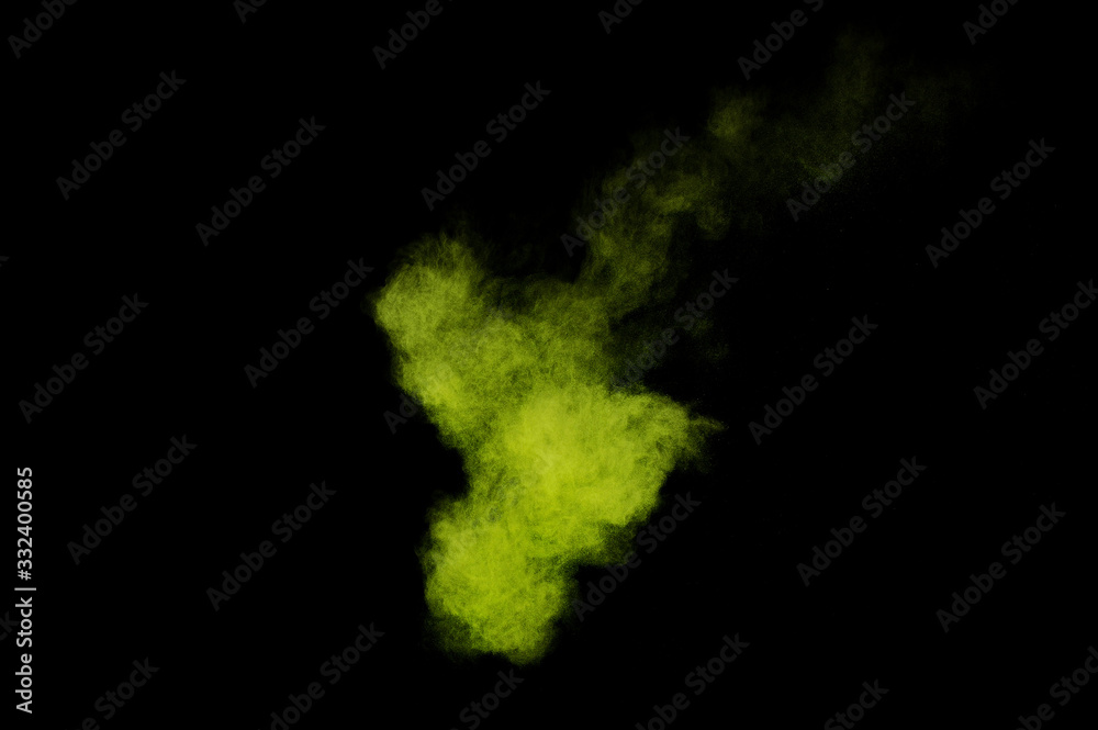 Light green powder explosion on black background. Colored powder cloud. Colorful dust explode. Paint  Holi.