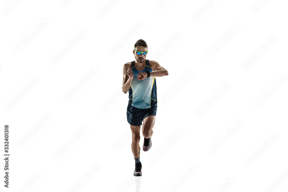 Triathlon male athlete running isolated on white studio background. Caucasian fit jogger, triathlete training wearing sports equipment. Concept of healthy lifestyle, sport, action, motion. Time check. Triathlon male athlete running isolated on white studio background. Caucasian fit jogger, triathlete training wearing sports equipment. Concept of healthy lifestyle, sport, action, motion. Time check.
