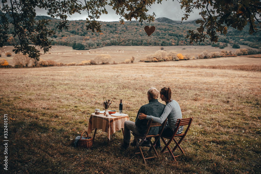 Couple together have lunch in autumn nature. Couple together have lunch in autumn nature.