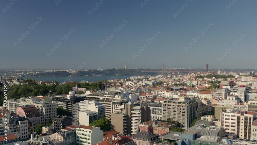 Lisbon cityscape aerial view. Lisbon bridge and christ the king on the background. Lisbon cityscape aerial view. Lisbon bridge and christ the king on the background.