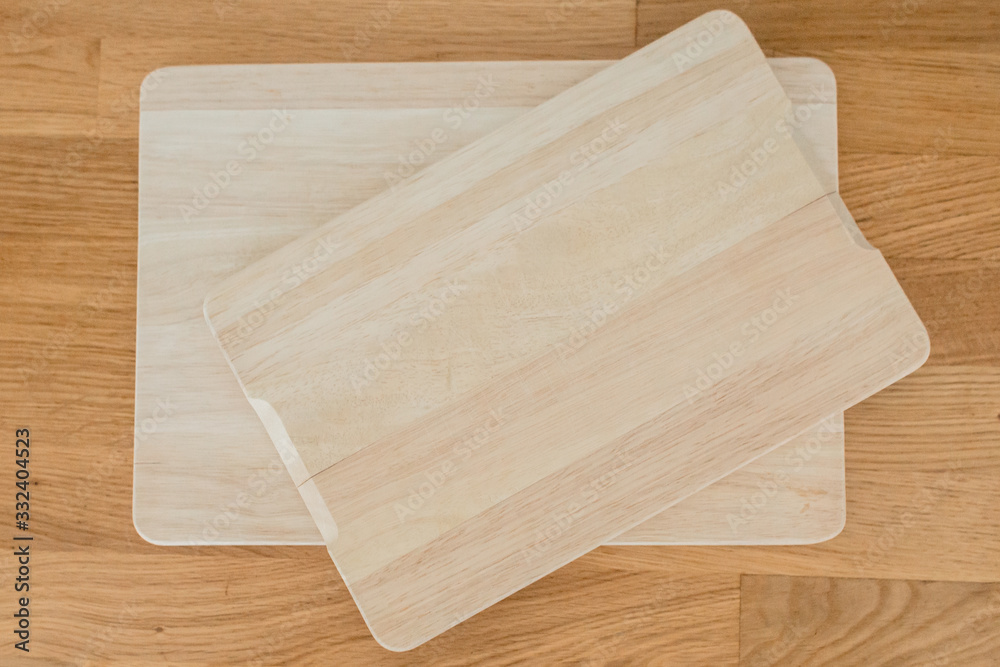 Kitchen wooden boards for cutting rye, vegetables, fruits, meat on the table. Wooden background