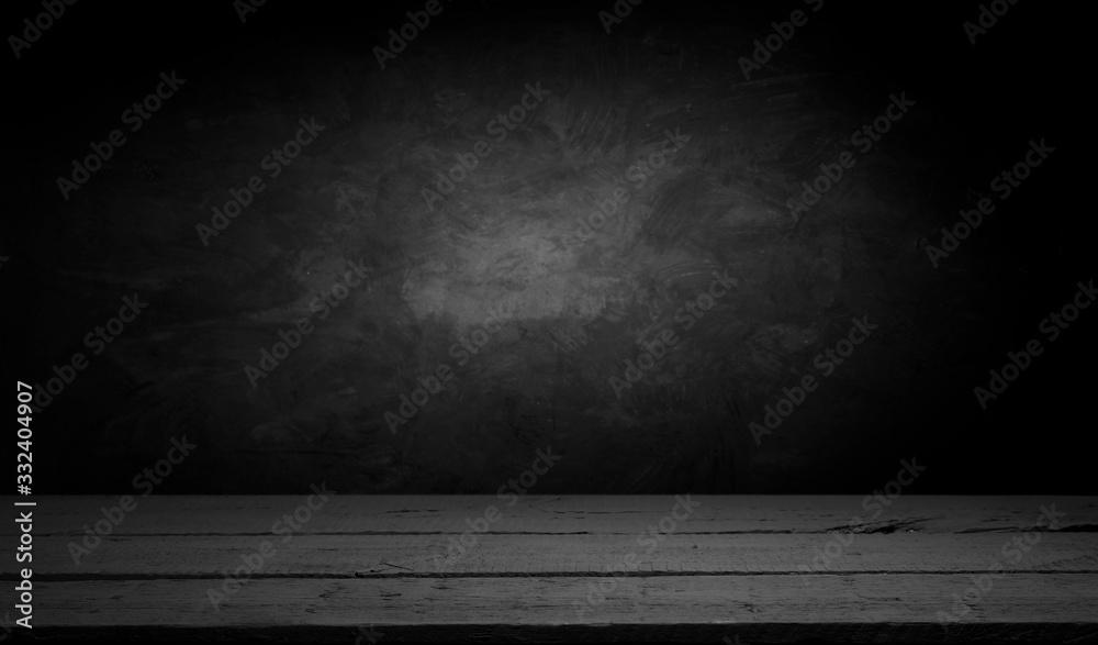 Selected focus empty brown wooden table and wall texture or old black brick wall blur background image. for your photomontage or product display Selected focus empty brown wooden table and wall texture or old black brick wall blur background image. for your photomontage or product display