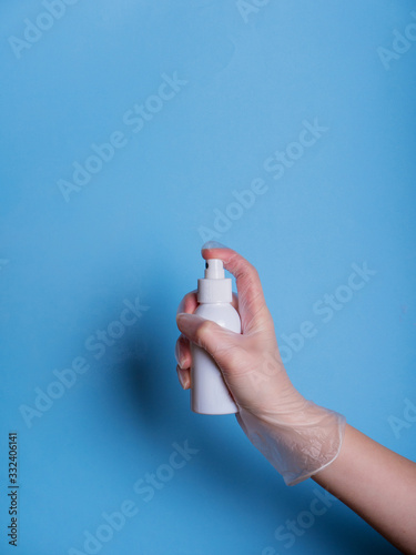 using alcohol gel clean wash hand sanitizer anti virus bacteria dirty skin care spray bottle on blue background clipping path. a bottle of alcohol washing hands.Stop and staying safe from COVID-19