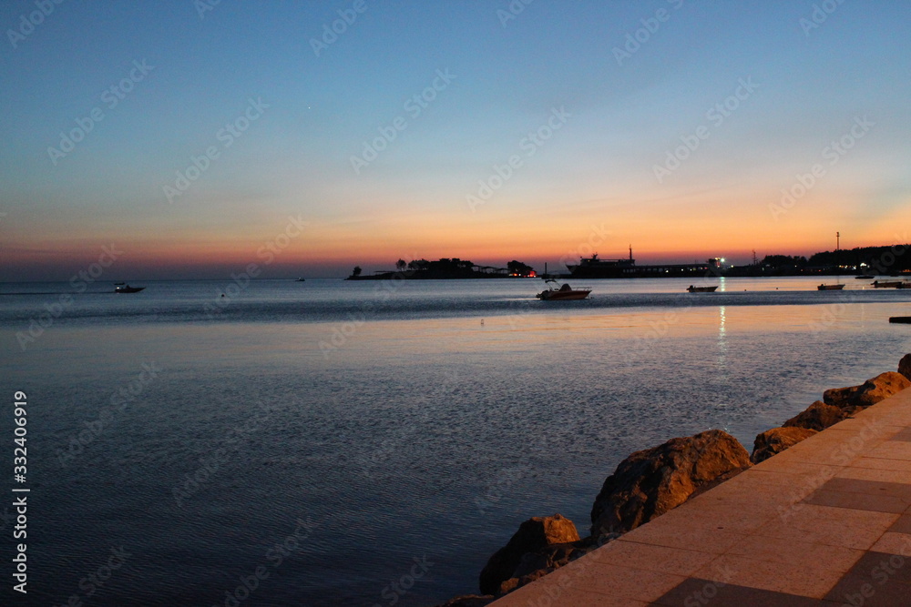 Obraz premium Beautiful seascape. Composition of nature, wonderful scenery, sea and sky reflection, beautiful sunset and beautiful day view