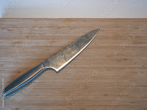 A large kitchen knife on a cutting board