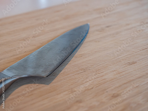 A large kitchen knife on a cutting board