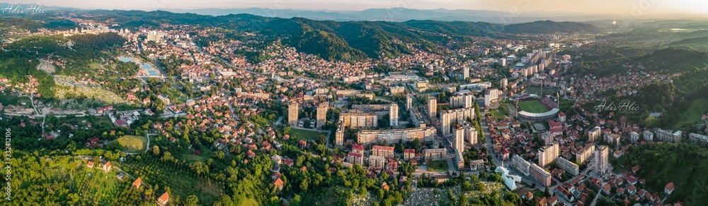 Aerial view of downtown Tuzla at sunset, Bosnia. City photographed by drone, traffic and objects , landscape.city photographed from air by drone.Old balkan buildings and communism type of architecture