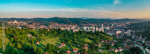 Aerial view of downtown Tuzla at sunset, Bosnia. City photographed by drone, traffic and objects , landscape.city photographed from air by drone.Old balkan buildings and communism type of architecture