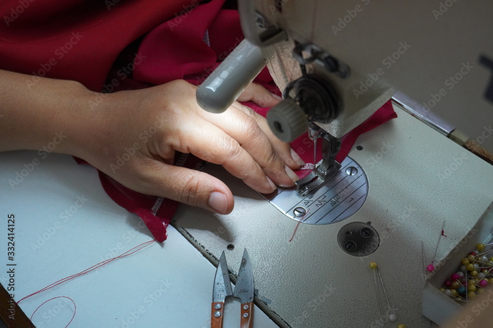 Asian women are sewing and designing