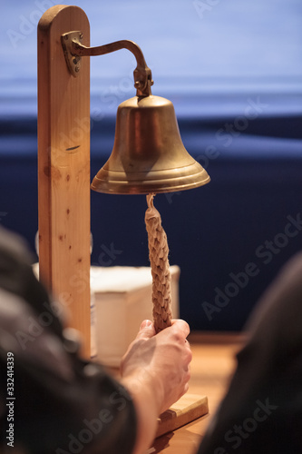hand holding a bell