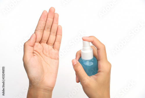 hand using alcohol spray for cleaning bacteria or virus 