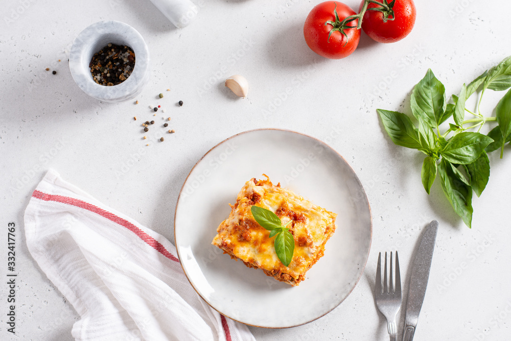 Traditional italian lasagna with vegetables, minced meat, cheese bolognese and bechamel sauce. Top view, menu, recipe. COpy space