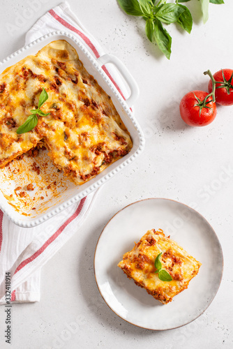 Delicious Homemade Italian Lasagna with bolognese and bachamel Sauce on white Background. Hot Tasty Lasagna with Parmesan Cheese. Restaurant menu, recipe