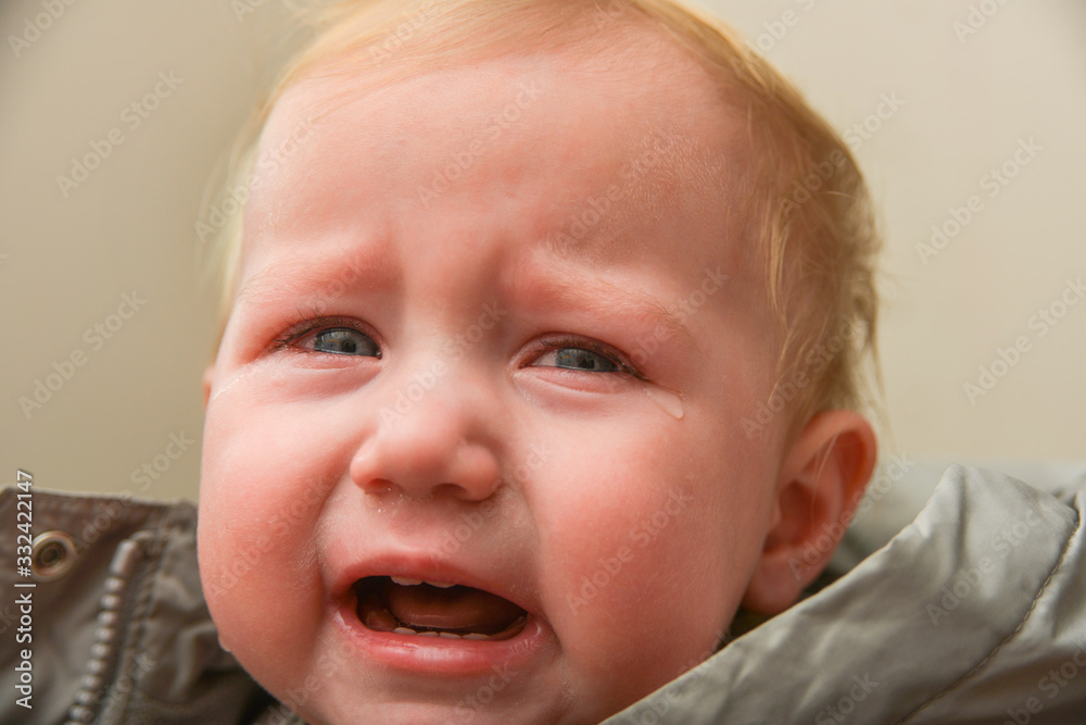 The child is crying with tears in his eyes, children's problems. The child is crying with tears in his eyes, children's problems.