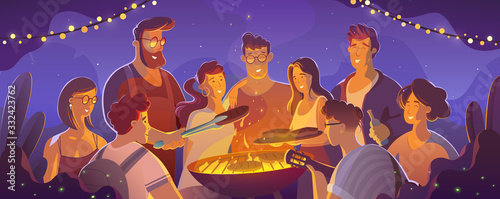 people and food concept - happy friends having meat for dinner at summer garden party at night.