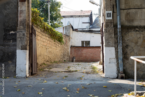 Deserted old yard in the old downtown. © indigolotos