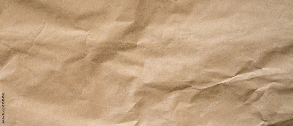 crumpled brown paper background and texture with copy  space. - obrazy, fototapety, plakaty 