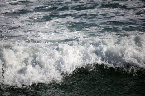 waves crashing on the beach © Chris