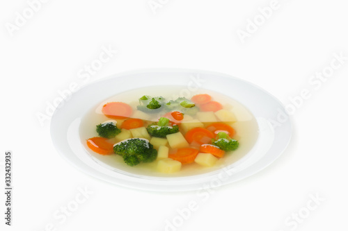Plate with soup isolated on white background