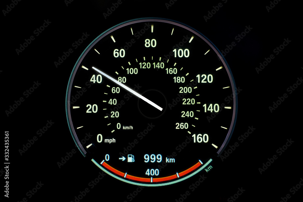 70 Kilometers per hour,light with car mileage with black background,number of speed,Odometer of car.	