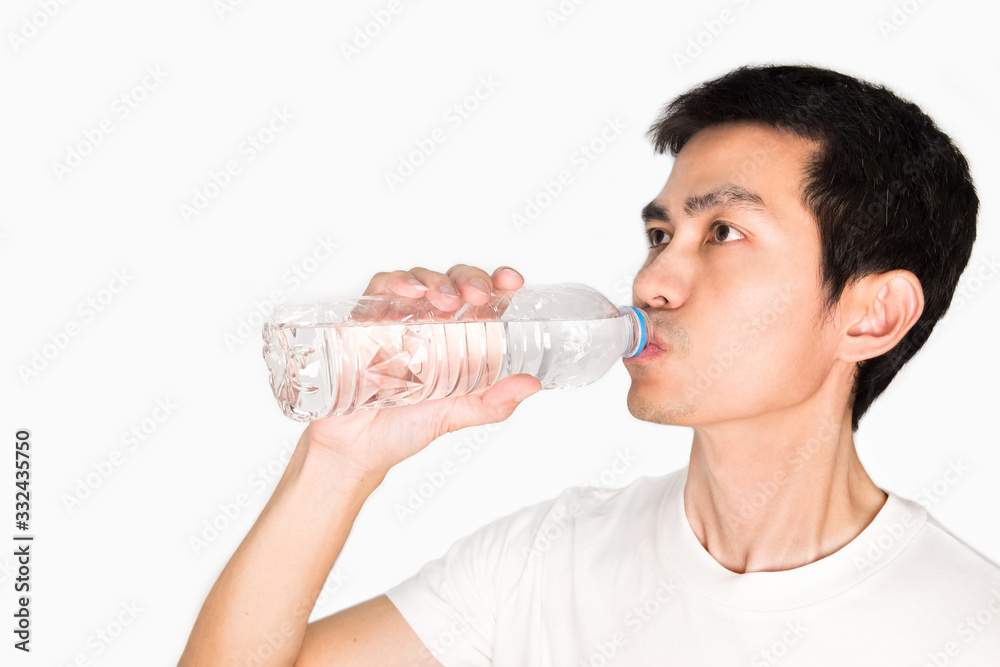 portrait of a man drinking purified water from bottle on white background. purified water is good for health to protect people from heat stoke from outdoor exercise in summer portrait of a man drinking purified water from bottle on white background. purified water is good for health to protect people from heat stoke from outdoor exercise in summer