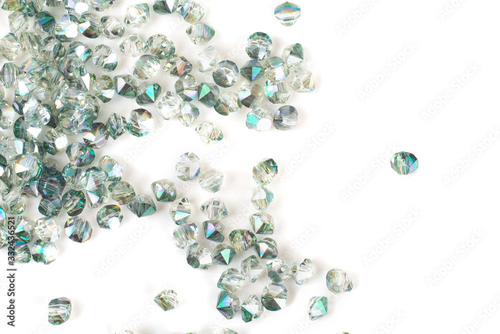 close up multi colored beads heap isolated on white close up multi colored beads heap isolated on white