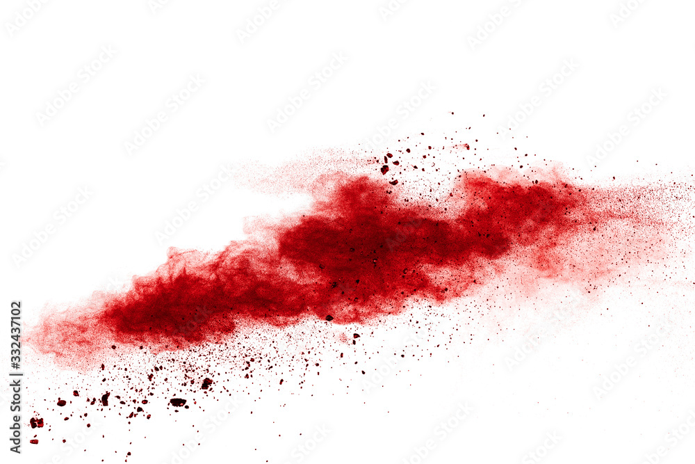 Red powder explosion cloud on white background. Freeze motion of red color dust  particles splashing.