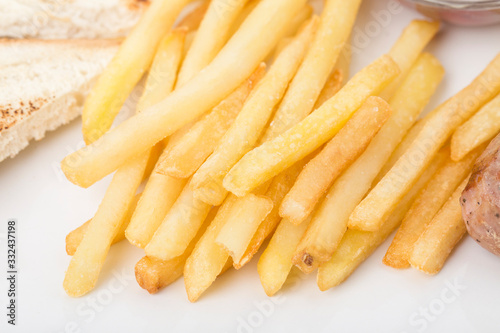 Fragmnet of the breakfast with french fries.
