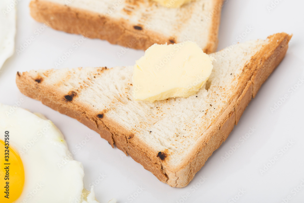 Fragmnet of the breakfast with the toast.