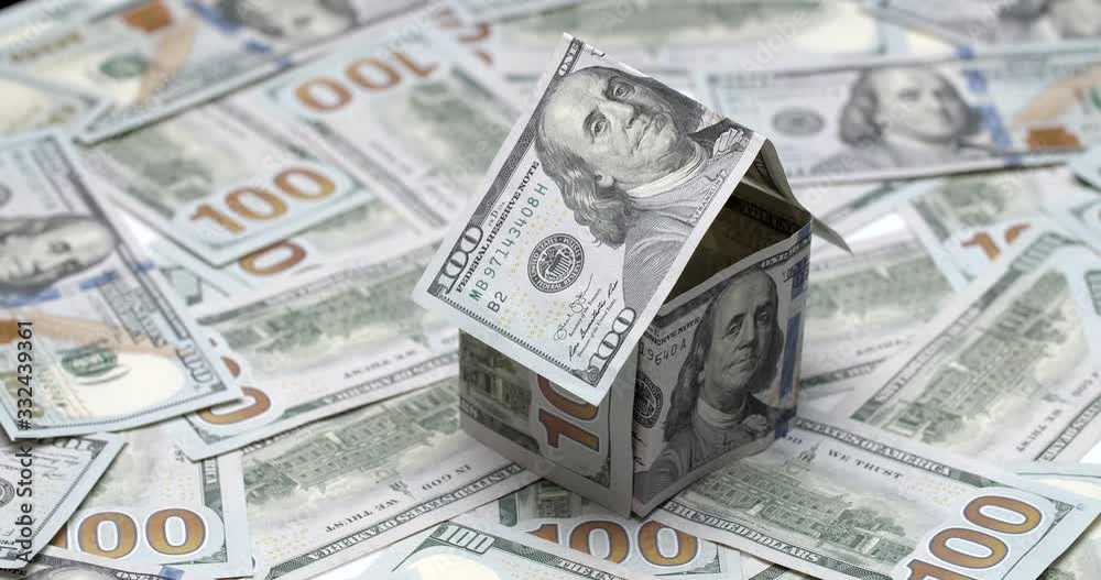 House made of USA dollar banknotes rotating, wealth concept, financial system House made of USA dollar banknotes rotating, wealth concept, financial system