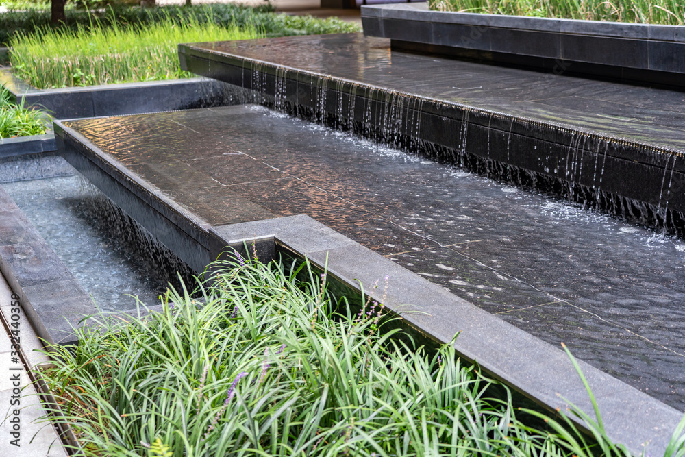 Water Feature Cascade as Part of Landscape Design. Stock Photo Adobe