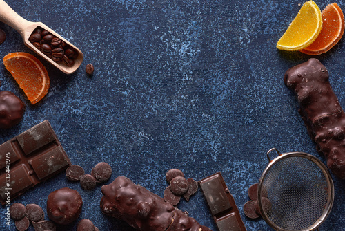 Chocolate and marmalade candys on blue background