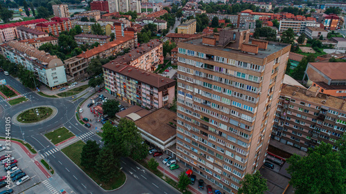 city photographed from air by drone. Old balkan buildings and communism type of architecture. Zenica - Bosnia and Herzegovina. Balkan city with nature around. photo