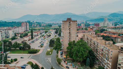 city photographed from air by drone. Old balkan buildings and communism type of architecture. Zenica - Bosnia and Herzegovina. Balkan city with nature around. photo