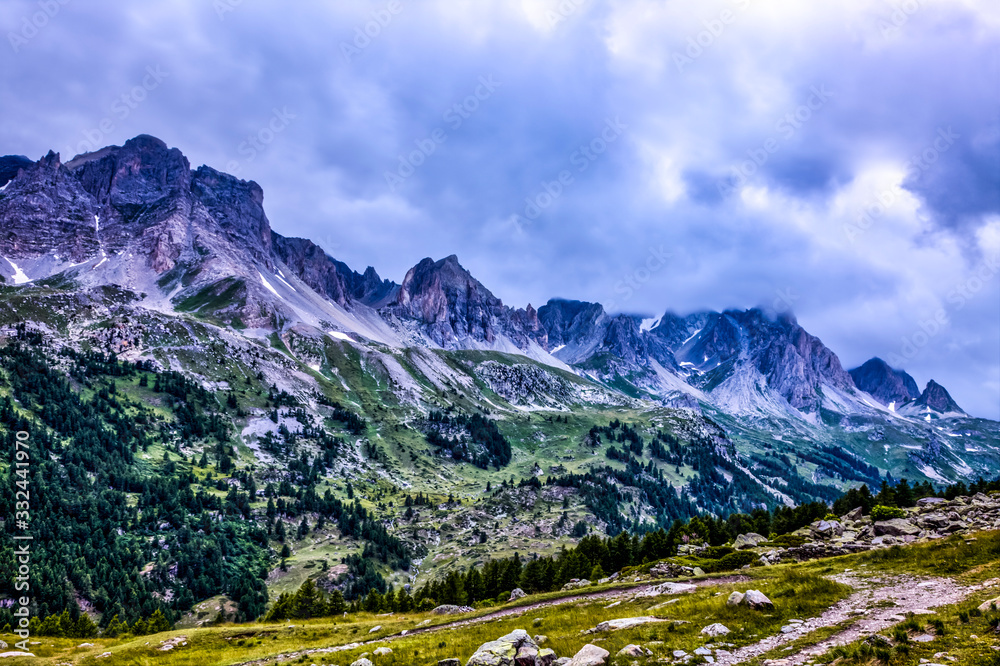 Beautiful cloudy high altitude landscape in the French Alps on Claree Valley in Hautes Alpes, Nevache, France