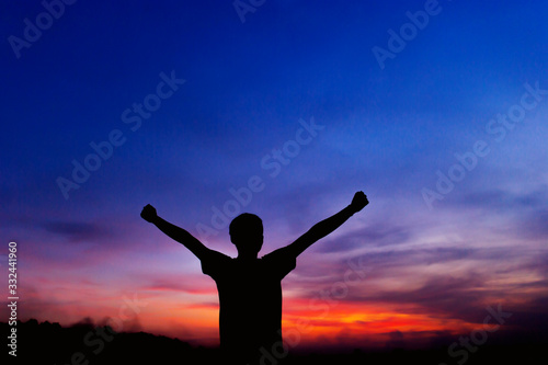 The silhouette of a man who enjoys life Freedom expressed by gestures, concepts, silhouettes