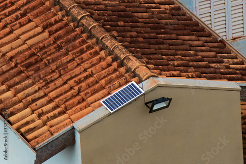 Solar panel powering light in a house  working on solar power