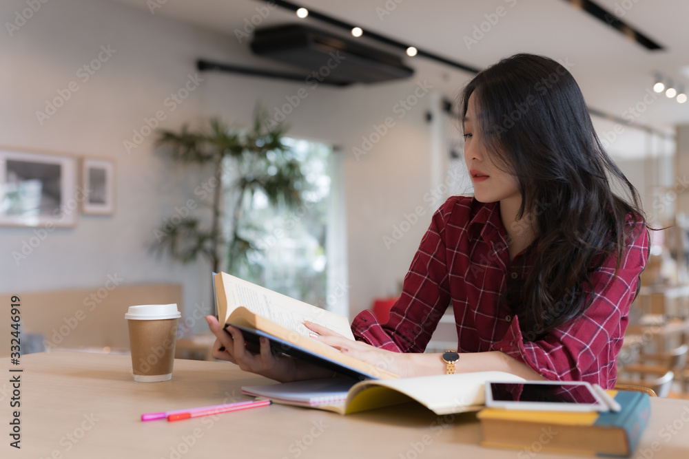 Close up of young business woman big smiling from ear to ear while holding tablet in her hand at table, successful concept Close up of young business woman big smiling from ear to ear while holding tablet in her hand at table, successful concept