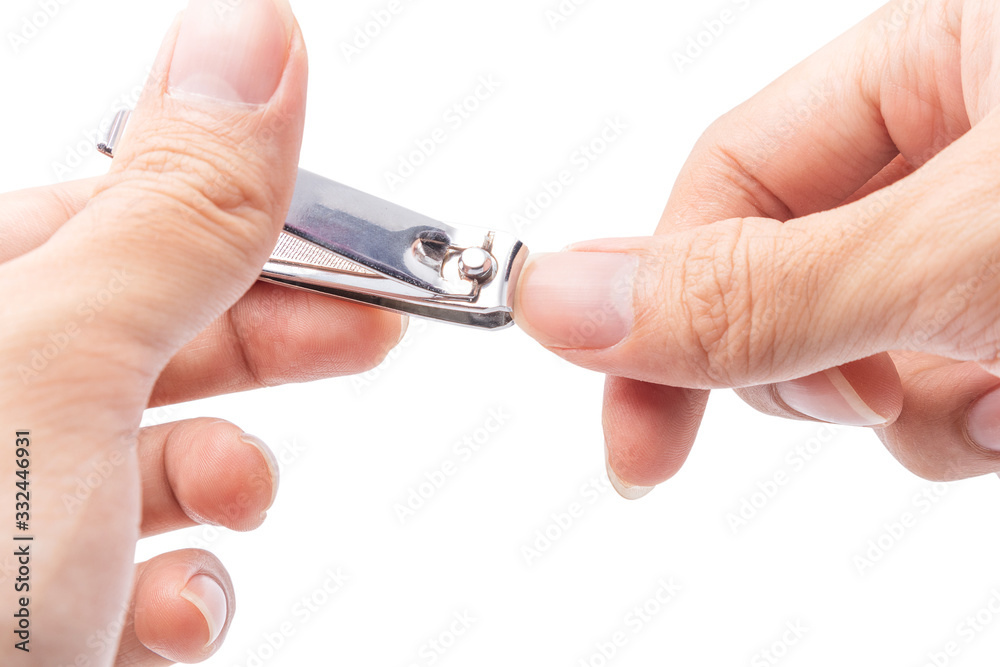 Close up cutting long fingernails and dirty using nail clipper, isolated on white background with clipping path, health care protection and cleanliness concept.