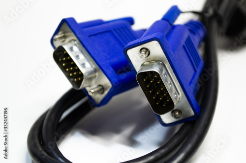 DVI and D-SUB cable for LCD and CRT monitors isolated on white background. Electronic black wire with blue connector.