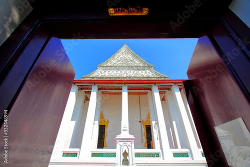 Buddhist temple, Wat Thepthidaram Worrisa in view through the door to the inside In Bangkok, Thailand photo