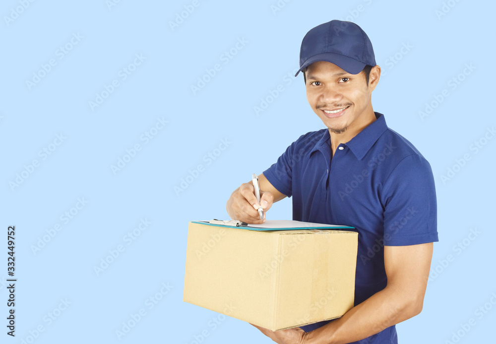 Delivery concept. young delivery holding box and writing something on clipboard. Delivery concept. young delivery holding box and writing something on clipboard.