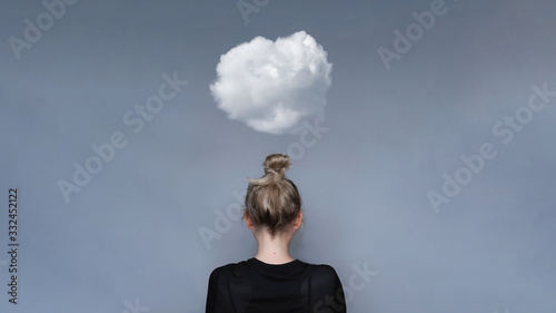 Young girl simple hairstyle back view with cloud above her head. Depression, loneliness and quarantine concept. Fashion model, trendy woman. Mental health metaphor concept
