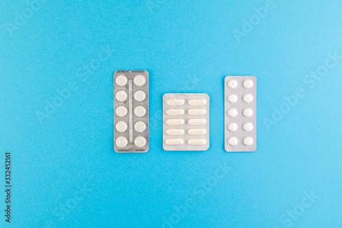 A set of hygienic antiseptics and medications on a blue background.