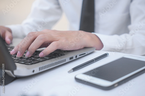 Businessman typing computer working in office