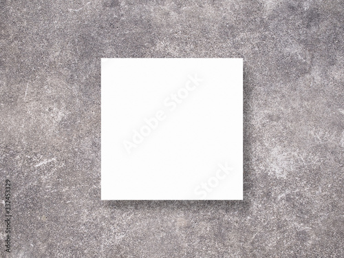 Blank white paper on cement background. Mockup scene. Photo mockup with clipping path.