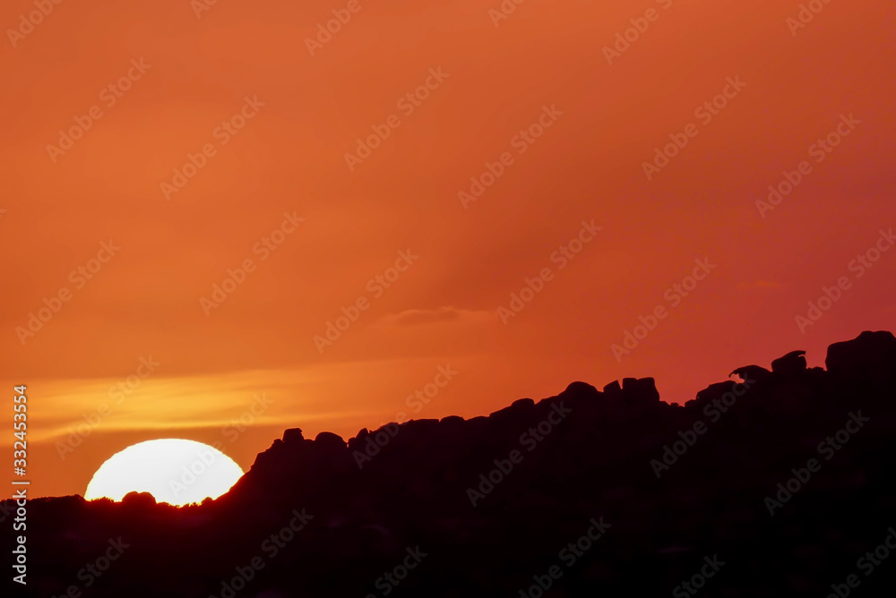 Sun Setting beyond Palau in Sardinia