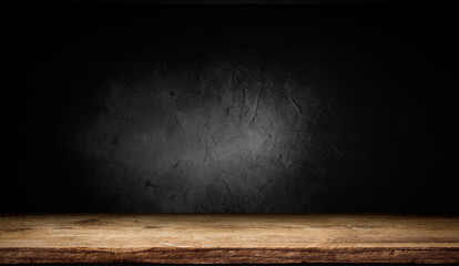 Selected focus empty brown wooden table and wall texture or old black brick wall blur background image. for your photomontage or product display